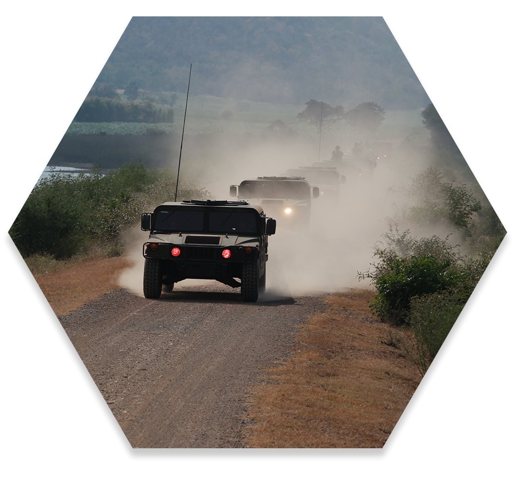 military vans driving through desert